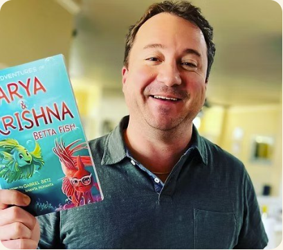 Gabriel Bietz holding The Adventures of Arya and Krishna Betta Fish